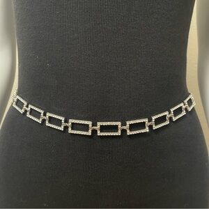 Silver tone metallic chain belt with rhinestone details